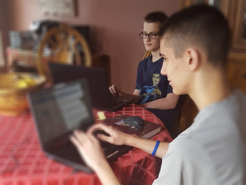 young men using computers