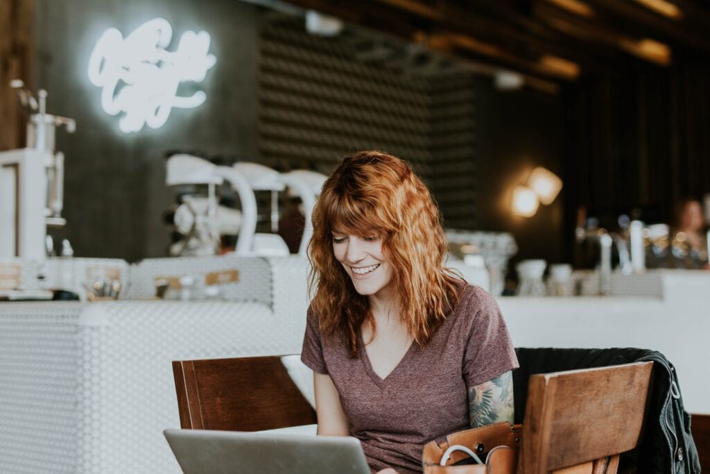 red head on laptop